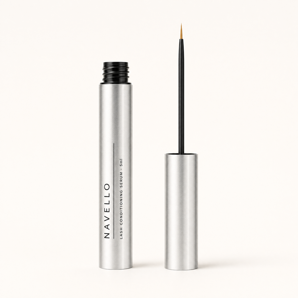 The Navello tube open beside its cap, with a fine applicator wand and a clean dry bristle tip.
