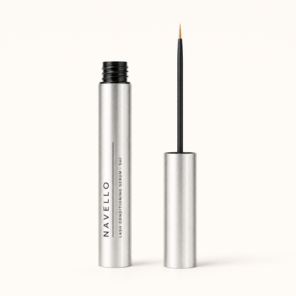 The Navello tube open beside its cap, with a fine applicator wand and a clean dry bristle tip.